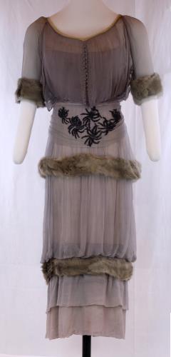 Front view of a purple fur hobble skirt from the 1910s