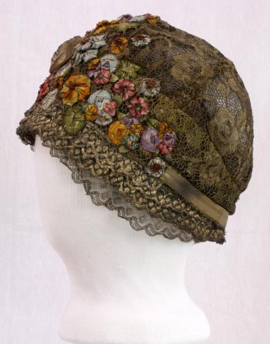 Left side view of a metalic cloche from the 1920s