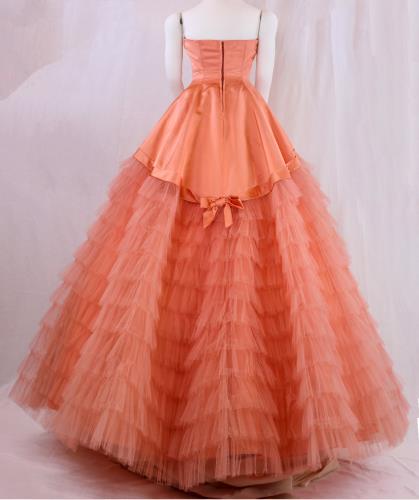 Back view of a salmon colored strapless satin gown from the 1950s