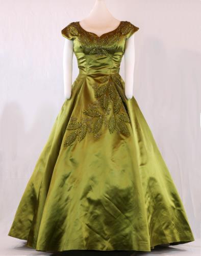 Front view (lighter) of a olive green, floor length, acetate satin evening gown from the 1950s