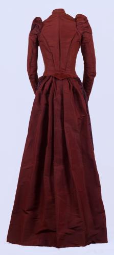 Back view of a hannifin burgandy dress, circa 1880.