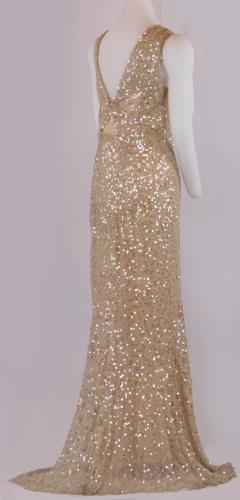 Back view of a floor length, sleeveless, sequined peach silk chiffon, circa 1930.