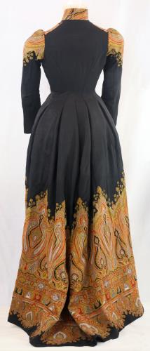 Back view of a black and paisley dress from the 1890s