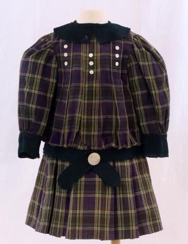 Front view of purple and green plaid dress from the 1900s
