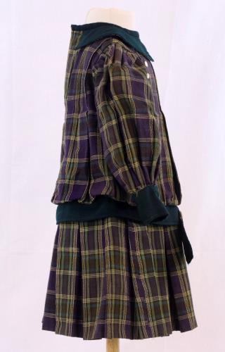 Side view of a purple and green plaid dress from the 1900s