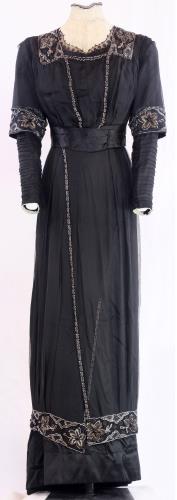 Front view of a two piece black silk gown from the 1910s