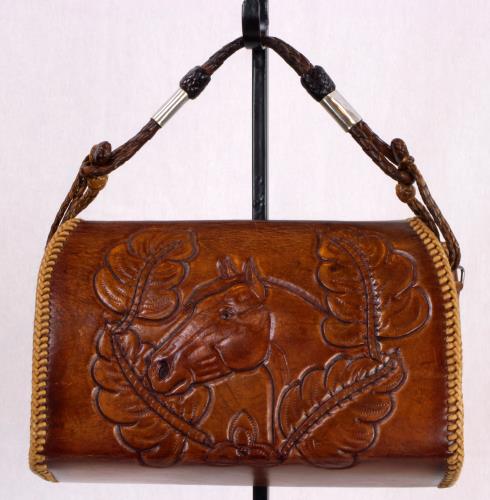 Back view of a heavy brown leather purse from the 1950s